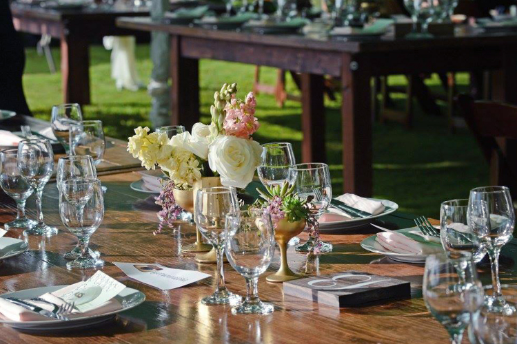 Tabletop scene with flowers and place settings