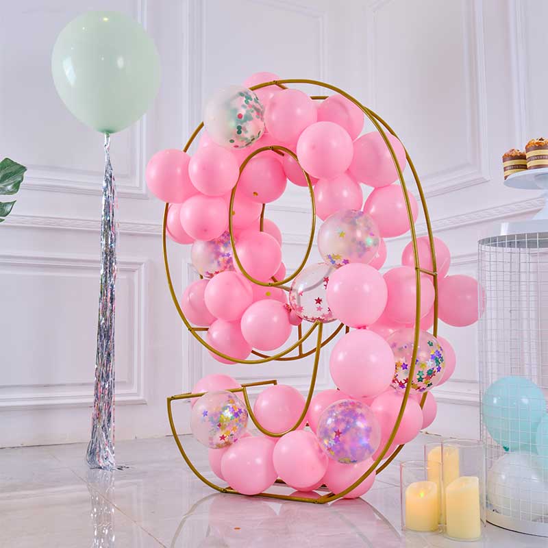 Gold Life-size number "9" with pink balloons