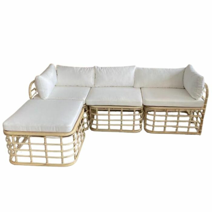 Rattan sectional sofa with white cushions